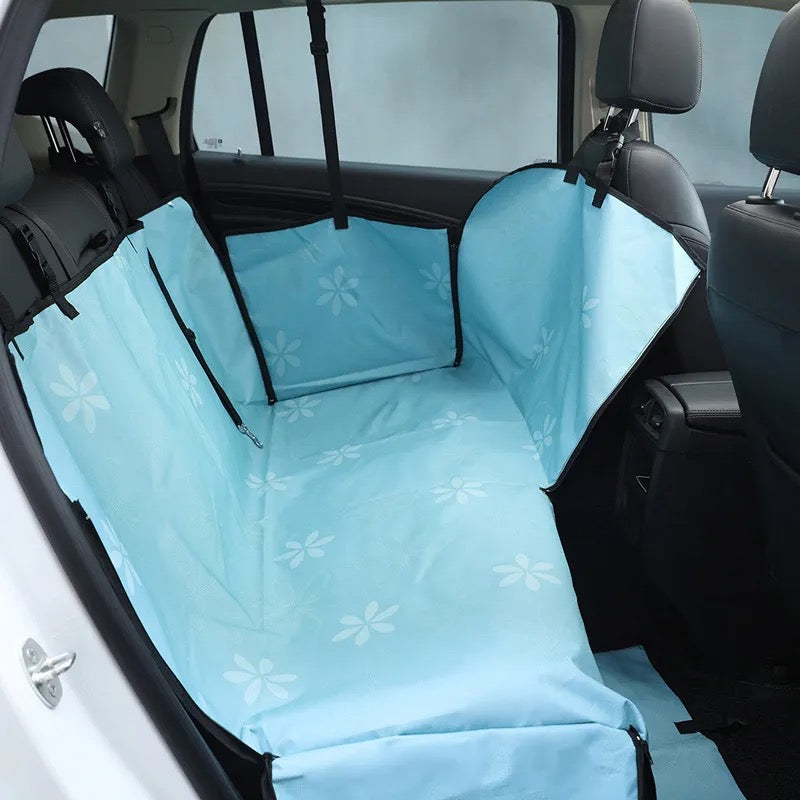 Dog backseat cover protects car interior from fur and dirt